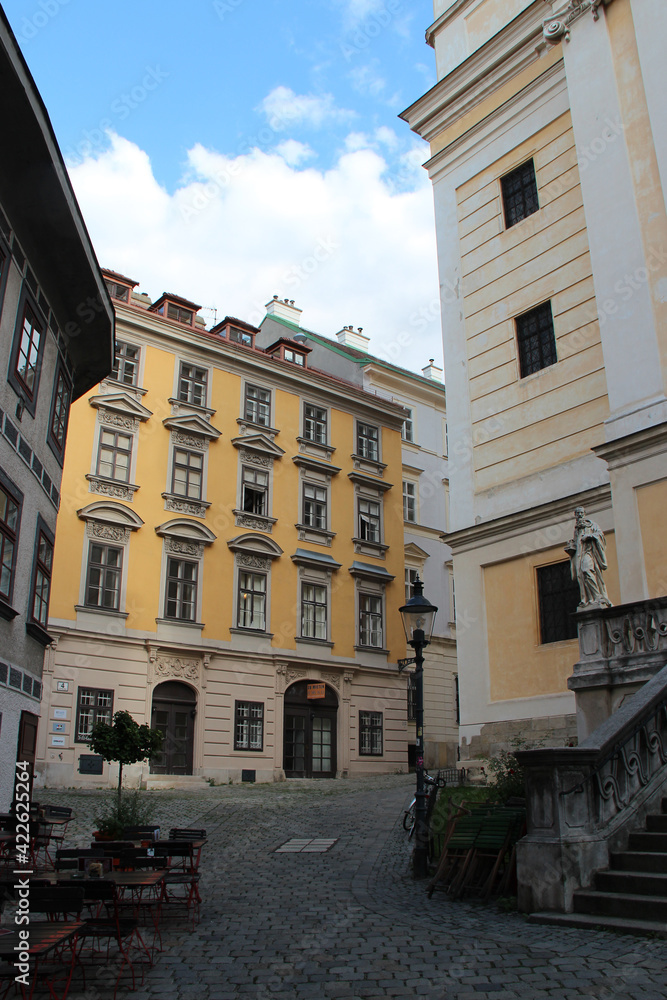 church (st ulrichs), alley and residential buildings in vienna (austria)