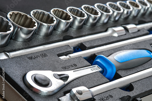 A set of auto mechanic tools. Tools: head crank, ratchet, imbus keys.