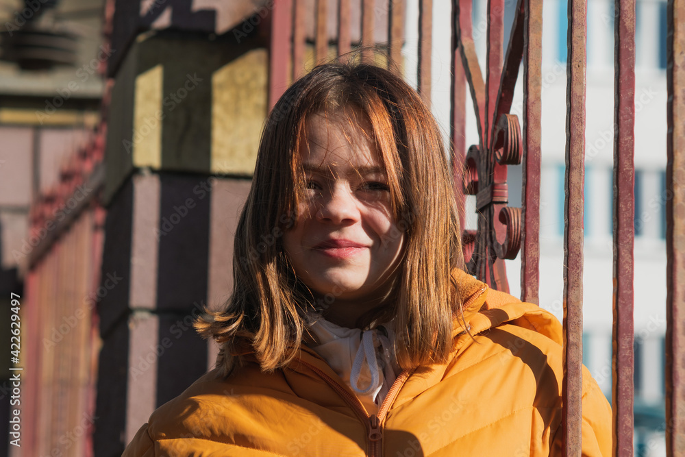 Portrait image of a young girl in the spring sun Portrait image of a young girl in the spring sun