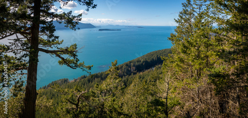 Western View of the San Juan Islands and the Salish Sea from Lummi Island  Washington. The top of Lummi Mountain provides a panoramic view of Orcas Island during a lovely springtime sunny day.