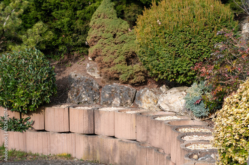 concrete elements filled with gravel at a garden wall