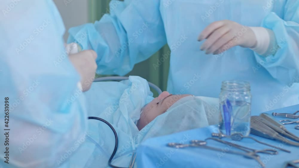 the surgeon performs a surgical operation the surgeon performs a surgical operation
