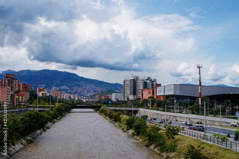 Panoramic view from a bridge over the river of the city of Medellin