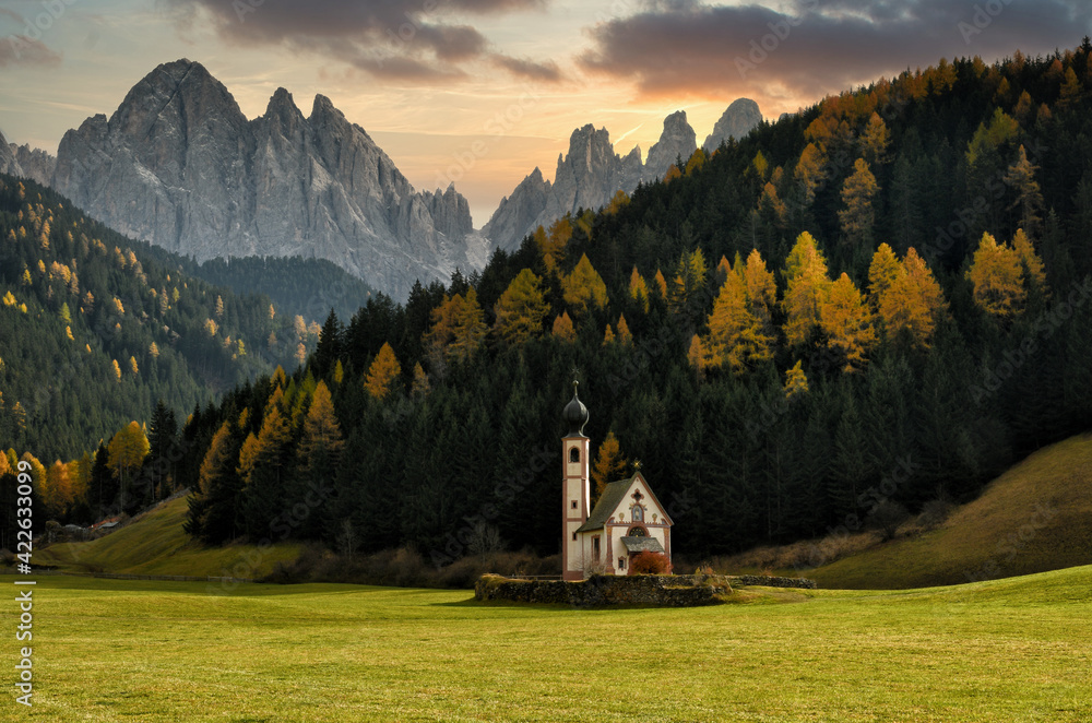 St. Johann (San Giovanni in Italian) Chapel in Val di Funes with the Dolomites Odle group on background. Northern Italy.
