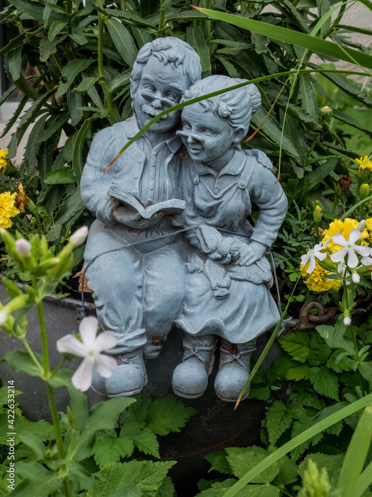 statue of  a couple in the garden