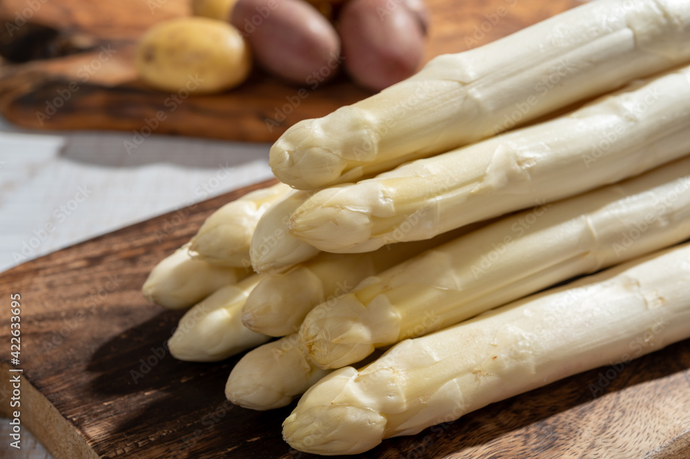 New harvest of high quality German white asparagus washed, uncooked, tasty vegetarian dinner