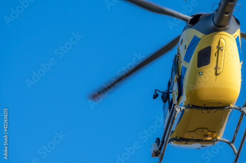 Helicopter flying in clear sky