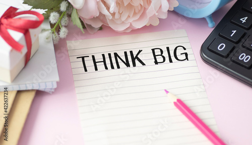 Think Big text on paper on office desk