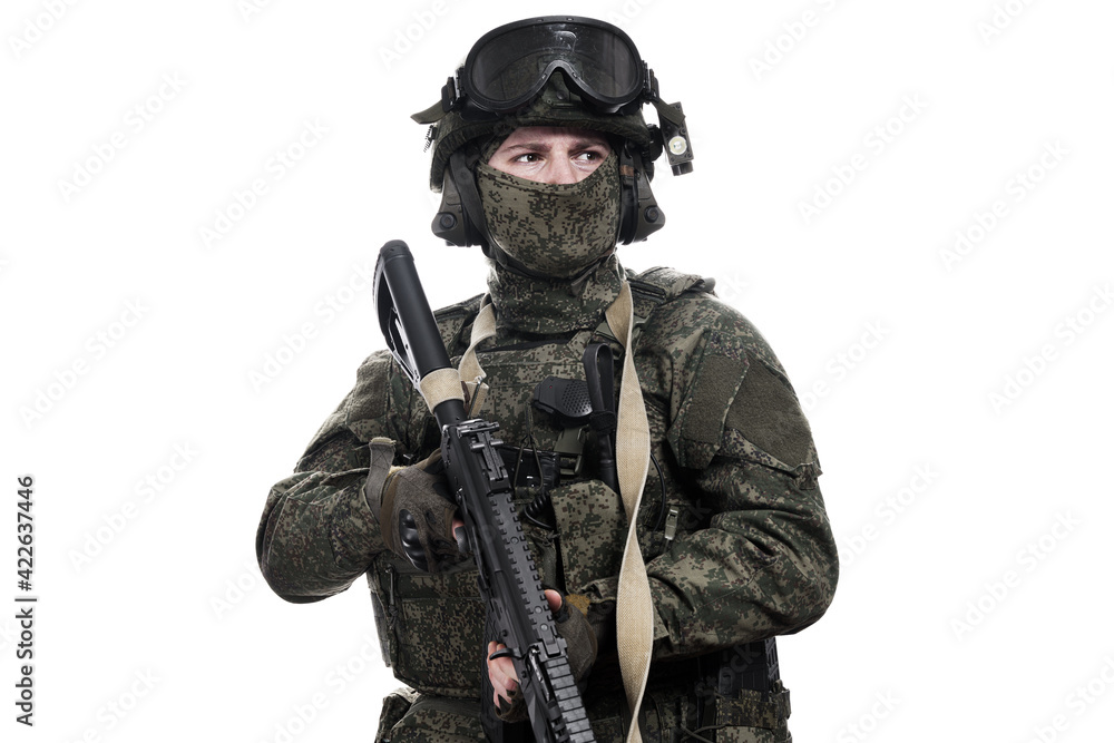 Male soldier in masking camo (green) suit. Shot in studio. Isolated on white background.