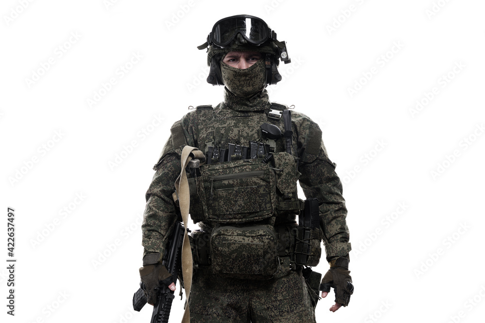 Male soldier in masking camo (green) suit. Shot in studio. Isolated on white background. Male soldier in masking camo (green) suit. Shot in studio. Isolated on white background.