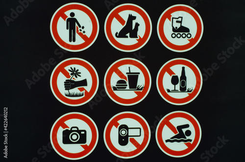 Many prohibition signs on one poster in a summer park. Do not litter, do not smoke, do not drink alcohol, do not light fires. Free Download Many prohibition signs on one poster in a summer park. Do not litter, do not smoke, do not drink alcohol, do not light fires. - GFXLoad