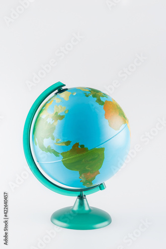 earth globe on stand isolated on grey, ecology concept