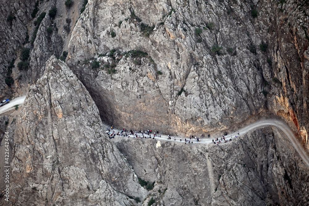 People watching the Dark Canyon view on the rock in Kemaliye (Egin), Erzincan, Turkey.