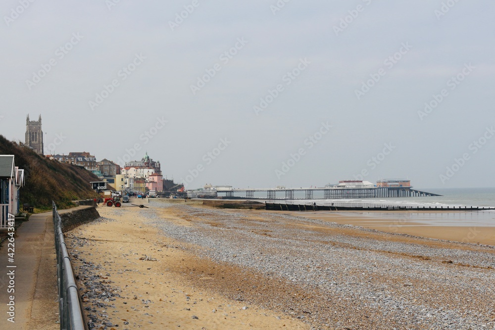 Cromer, Nortfolk, dinstant view of the town from the shore, pier on a foggy morning, winter, seaside gentle waves crashing on the shore, north sea, seascape, northern Europe Cromer, Nortfolk, dinstant view of the town from the shore, pier on a foggy morning, winter, seaside gentle waves crashing on the shore, north sea, seascape, northern Europe