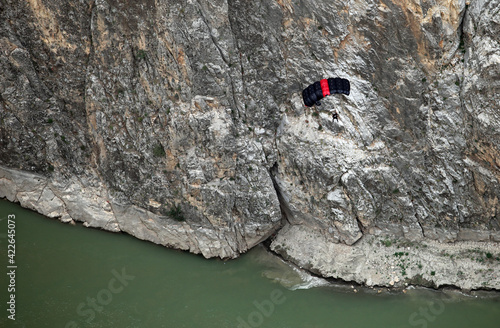 Base Jump after paragliding on the Dark Canyon in district of Kemaliye (Egin), Erzincan, Turkey. Kemaliye is extreme sport center in Eastern Turkey. photo