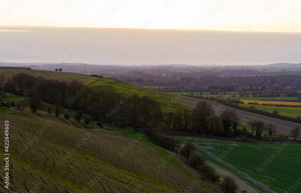 a scenic landscape view across Pewsey Vale and Pewsey Village in Wiltshire, North Wessex Downs AONB