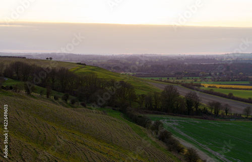 a scenic landscape view across Pewsey Vale and Pewsey Village in Wiltshire, North Wessex Downs AONB © Martin