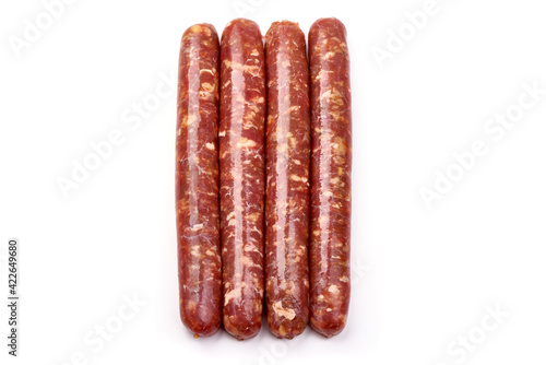 Fresh raw beef sausages, isolated on white background