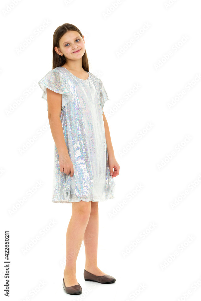 Beautiful long haired girl in shiny trendy dress Beautiful long haired girl in shiny trendy dress