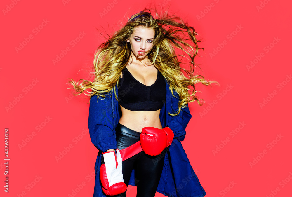 Sexy Woman boxer with gloves. Sporty girl in boxing gloves. Healthy lifestyle. Fitness.