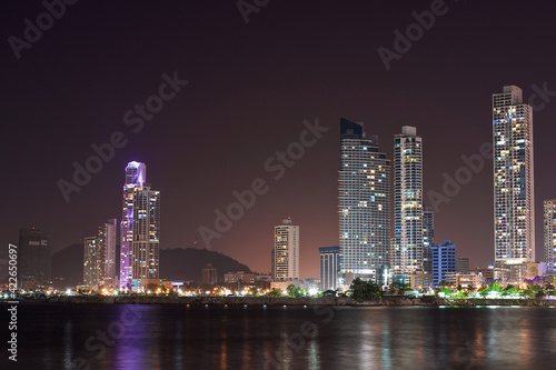 night Cityscape from across the bay in Panama with a serene reflection on the water. 
