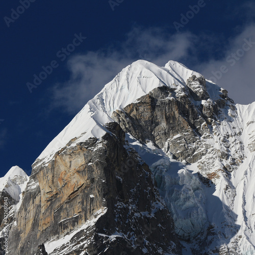 High mountain Lobuche West covered by glacier. photo