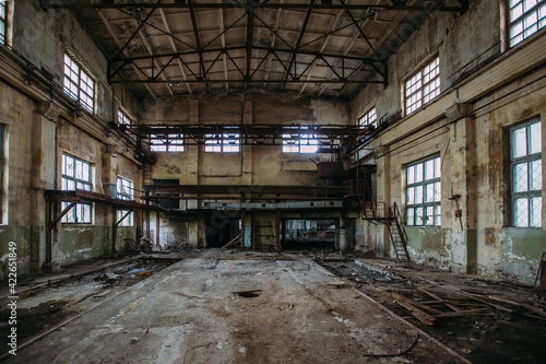 Abandoned concrete factory. Large empty industrial hall