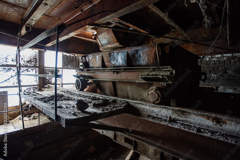 Old rusty trolley in abandoned factory