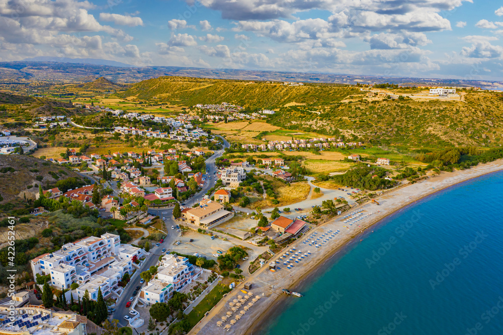 Panorama from Cyprus beach. Pissouri resort view from  drone. Resort hotels with access to beach. Panorama of beach of city of Pissouri. Rest on island of Cyprus. Nature of Republic of Cyprus.