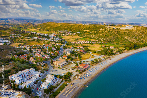 Panorama from Cyprus beach. Pissouri resort view from drone. Resort hotels with access to beach. Panorama of beach of city of Pissouri. Rest on island of Cyprus. Nature of Republic of Cyprus.