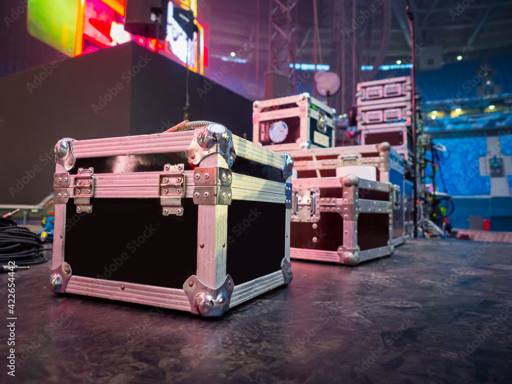 Preparation for concert concept. Cases for musical equipment on stage