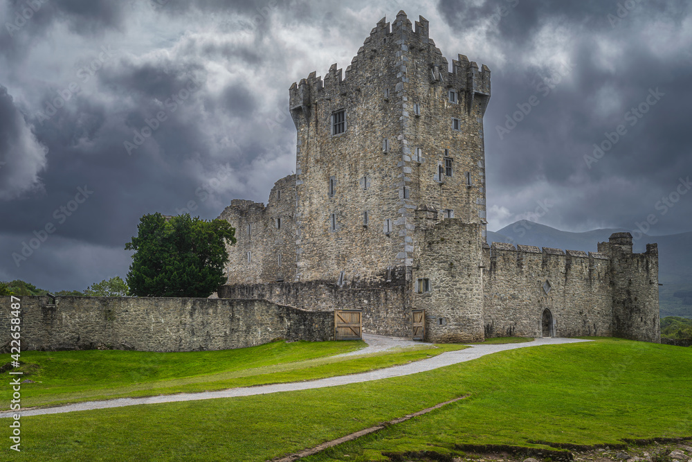 Old keep from 15th century, Ross Castle located on the bank of Lough Leane with dramatic storm clouds in background, Ring of Kerry, Killarney, Ireland