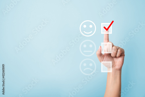 Hand choose to rating score happy icons. Customer service experience and business satisfaction survey concept photo