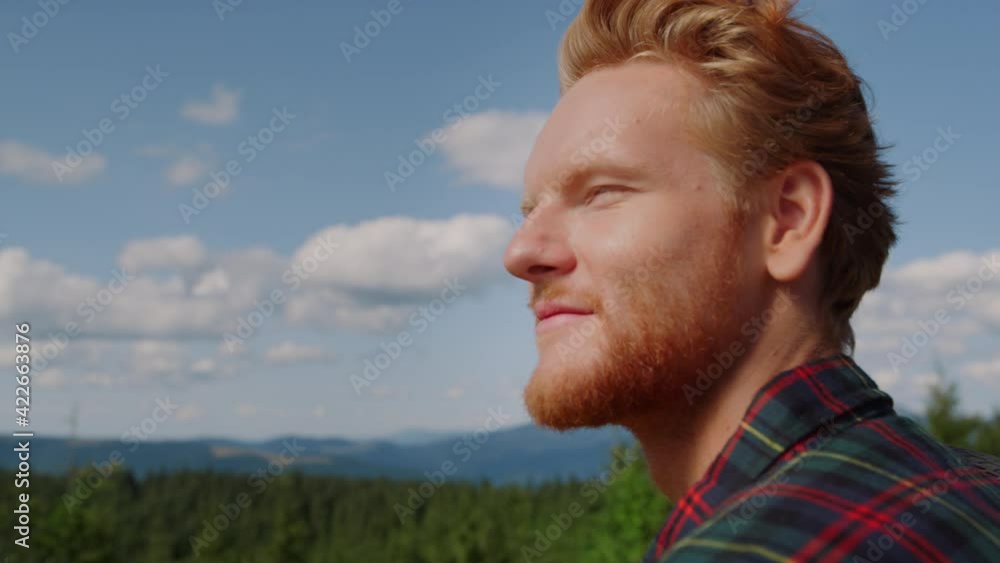 Guy enjoying mountain landscape at summer. Male traveler looking green woods Guy enjoying mountain landscape at summer. Male traveler looking green woods