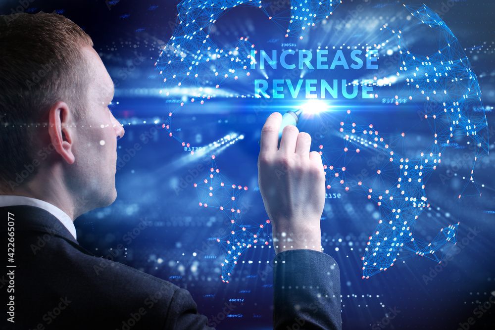 Business, Technology, Internet and network concept. Young businessman working on a virtual screen of the future and sees the inscription: Increase revenue Business, Technology, Internet and network concept. Young businessman working on a virtual screen of the future and sees the inscription: Increase revenue