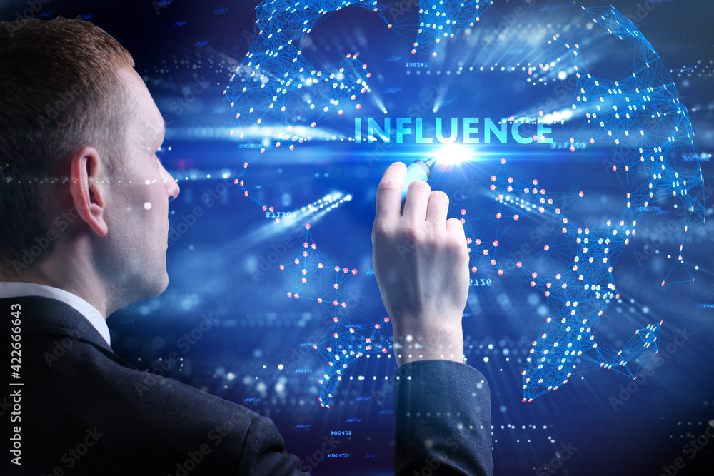 Business, Technology, Internet and network concept. Young businessman working on a virtual screen of the future and sees the inscription: Influence Business, Technology, Internet and network concept. Young businessman working on a virtual screen of the future and sees the inscription: Influence