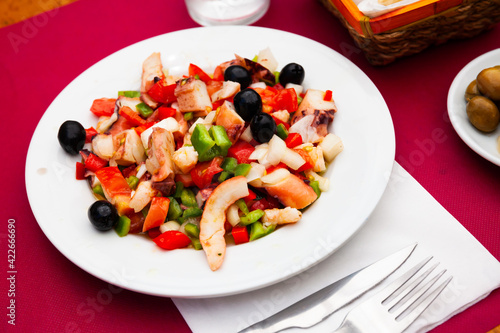 Salad Salpicon de marisco with olives, shrimps, octopus, mussels and cucumbers