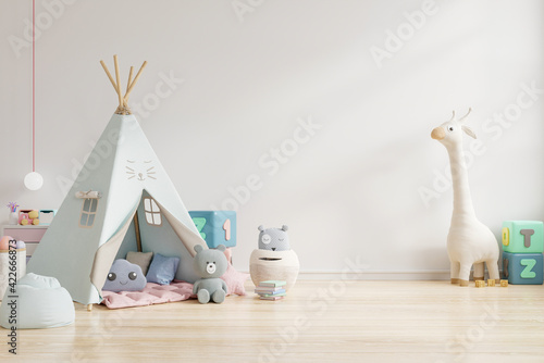 Children's playroom with tent and table sitting white wall,doll.