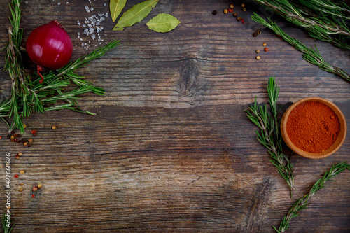 Fototapeta Naklejka Na Ścianę i Meble -  Top view of aromatic dry herbs and spices on wooden table.