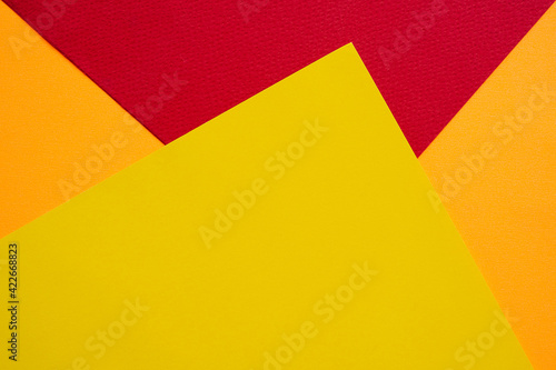 Papers yellow red orange chape background. design colorful abstract wallpapers. flat lay or top view with copy space for add text or products. celebration or summer travel in holidays concept