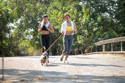  Asian women running with dog
