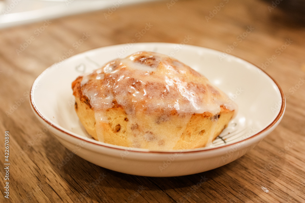 Delicious hot cinnamon roll with icing Delicious hot cinnamon roll with icing