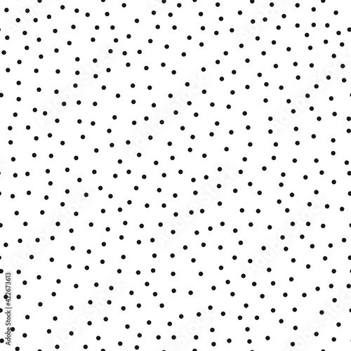 Seamless pattern. Points in a chaotic order, black on a white background.
