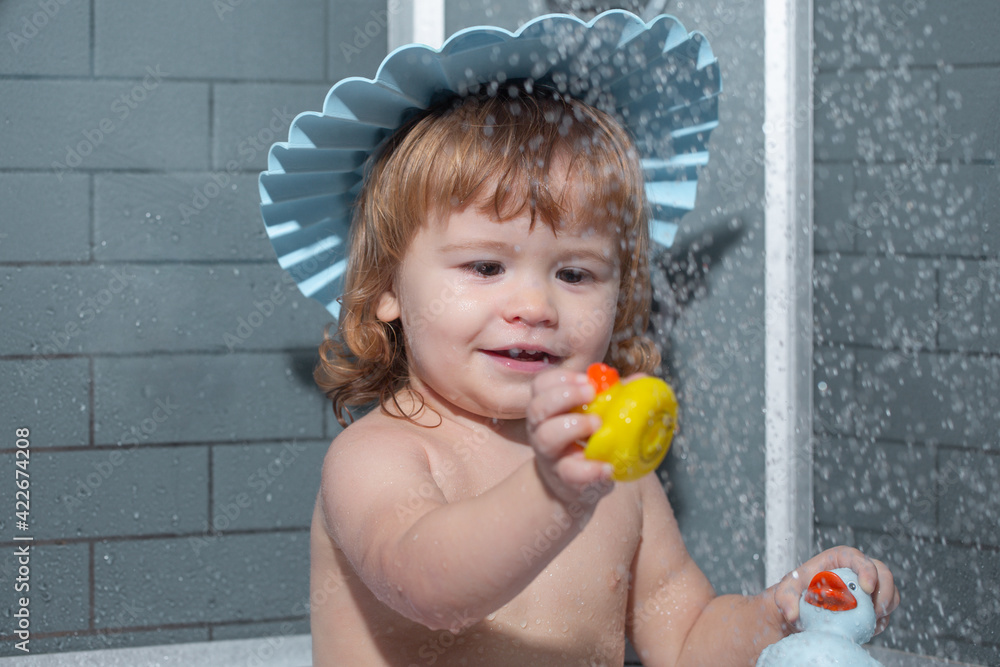 Child in bathroom play with foam. Cute baby boy enjoying bath and bathed in the bathroom. Child in bathroom play with foam. Cute baby boy enjoying bath and bathed in the bathroom.