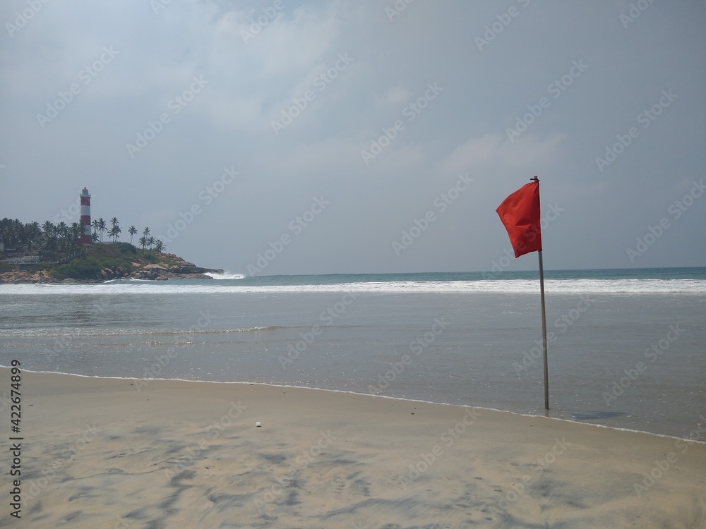 red flag on the beach, Kovalam beach seascape view, Thiruvananthapuram Kerala