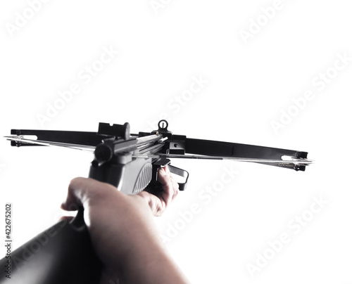 Foto Forest hunting crossbow gun isolated on colored background