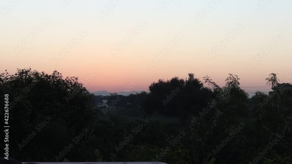 time lapse view of Beautiful bright sunrise behind silhouette trees silhouette mountain ranges.concept for Sun rise from behind silhouette mountains, time lapse of sunrise, time laps of sunset , sun. time lapse view of Beautiful bright sunrise behind silhouette trees silhouette mountain ranges.concept for Sun rise from behind silhouette mountains, time lapse of sunrise, time laps of sunset , sun.