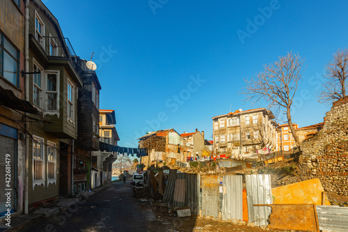 Old dilapidated residential buildings in historic quarter Eminonu in Fatih district of Istanbul in Turkey. Photo made in 2021