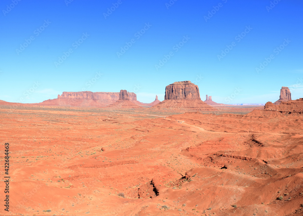Mitten and Merrick Butte in the distance, Monument Valley, Arizona Mitten and Merrick Butte in the distance, Monument Valley, Arizona
