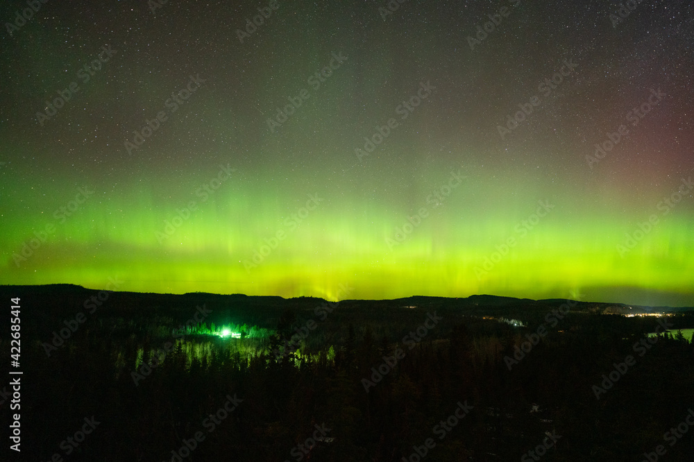Northern Lights or Aurora Borealis in the Night Sky, Amazing Starry Night Background on Minnesota North Shore